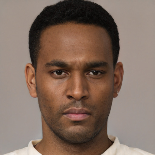 Neutral black young-adult male with short  black hair and brown eyes