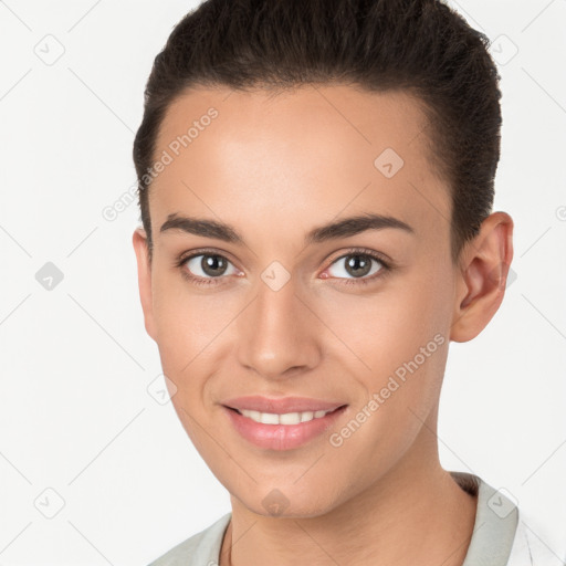 Joyful white young-adult female with short  brown hair and brown eyes