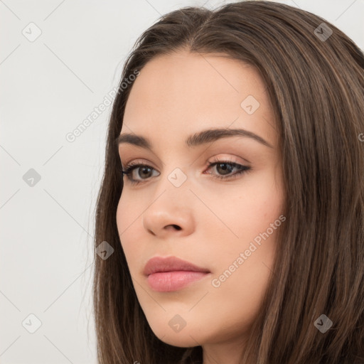 Neutral white young-adult female with long  brown hair and brown eyes