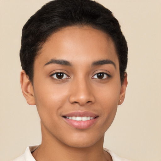 Joyful latino young-adult female with short  brown hair and brown eyes