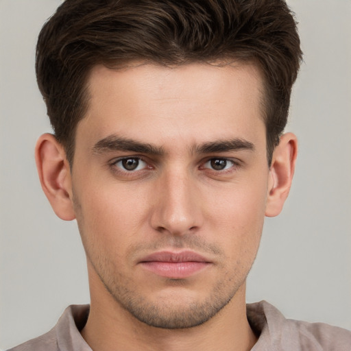 Neutral white young-adult male with short  brown hair and brown eyes