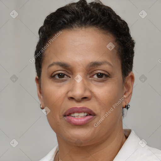 Joyful black adult female with short  brown hair and brown eyes