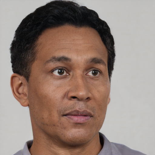 Neutral asian adult male with short  brown hair and brown eyes