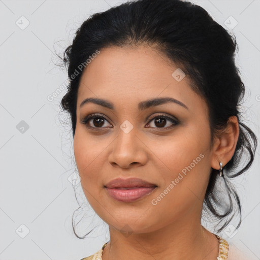 Joyful latino young-adult female with medium  brown hair and brown eyes