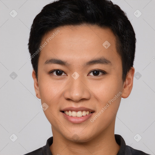 Joyful asian young-adult male with short  black hair and brown eyes