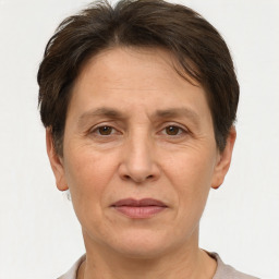 Joyful white adult female with short  brown hair and brown eyes