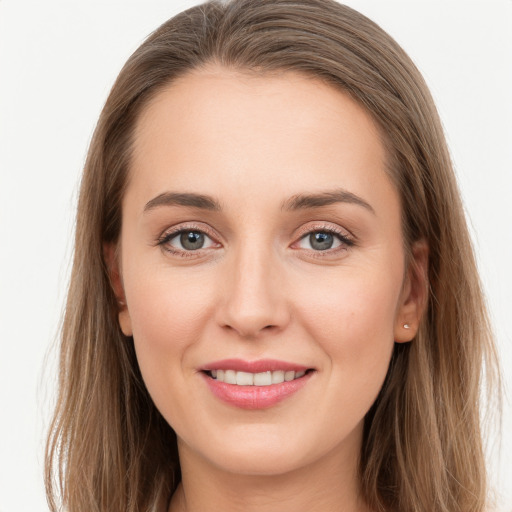 Joyful white young-adult female with long  brown hair and grey eyes