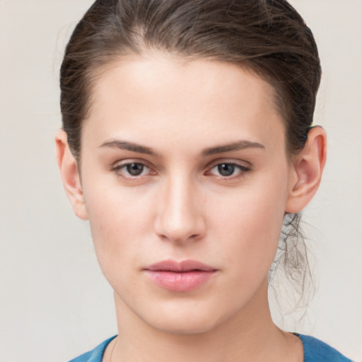 Neutral white young-adult female with medium  brown hair and grey eyes