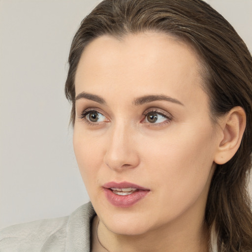 Neutral white young-adult female with medium  brown hair and brown eyes