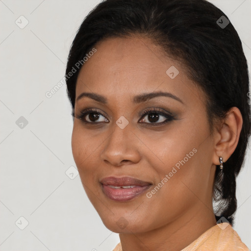 Joyful black young-adult female with short  black hair and brown eyes