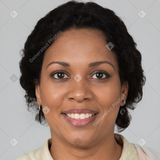 Joyful black adult female with medium  brown hair and brown eyes