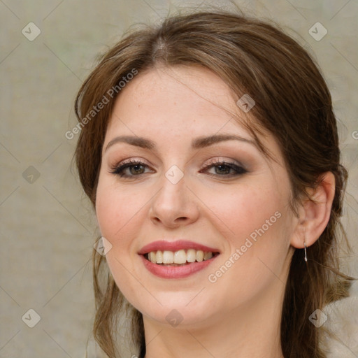 Joyful white young-adult female with medium  brown hair and green eyes