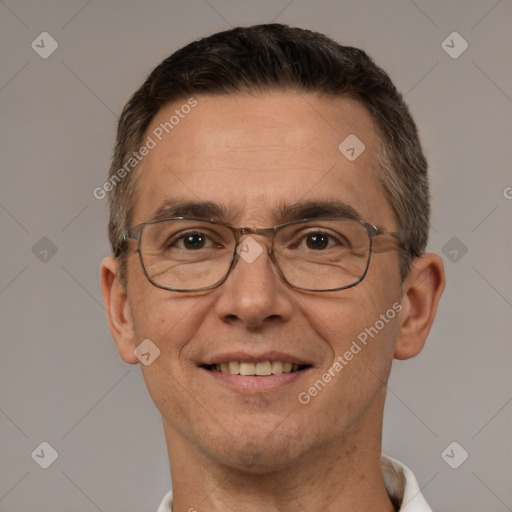 Joyful white adult male with short  brown hair and brown eyes