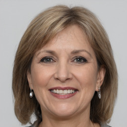 Joyful white adult female with medium  brown hair and grey eyes