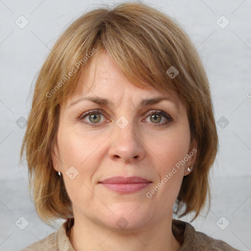 Joyful white adult female with medium  brown hair and grey eyes