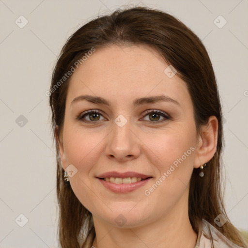 Joyful white young-adult female with medium  brown hair and green eyes