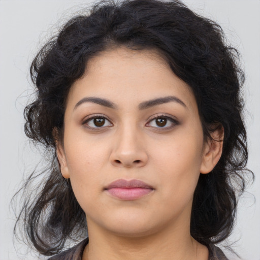 Neutral latino young-adult female with long  black hair and brown eyes