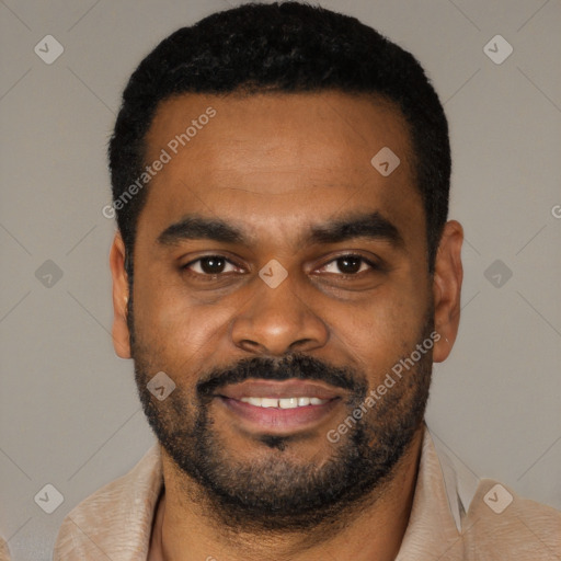 Joyful black young-adult male with short  black hair and brown eyes