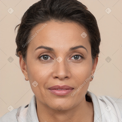 Joyful white adult female with short  brown hair and brown eyes