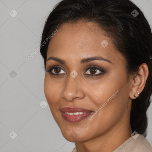 Joyful black young-adult female with medium  brown hair and brown eyes