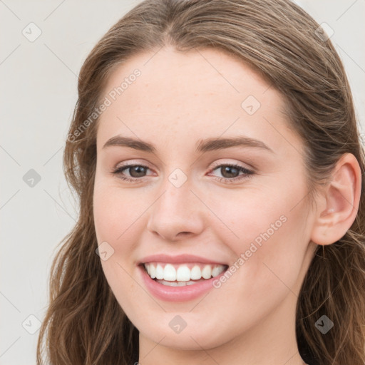 Joyful white young-adult female with long  brown hair and grey eyes