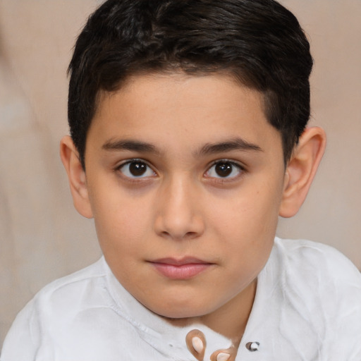 Joyful white child male with short  brown hair and brown eyes