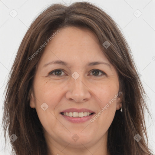 Joyful white adult female with long  brown hair and brown eyes