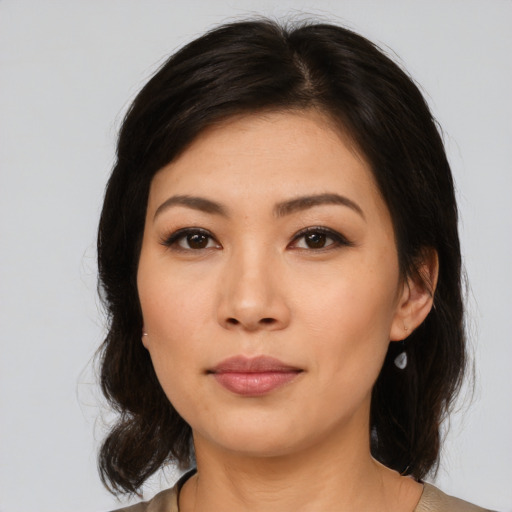 Neutral asian young-adult female with medium  brown hair and brown eyes