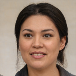 Joyful white young-adult female with medium  brown hair and brown eyes