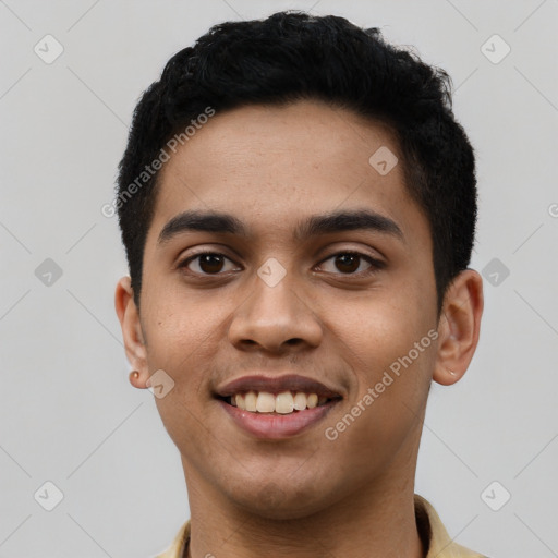 Joyful latino young-adult male with short  black hair and brown eyes