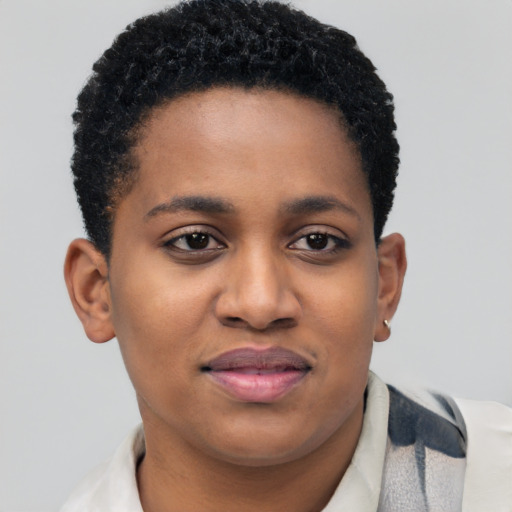 Joyful black young-adult female with short  brown hair and brown eyes
