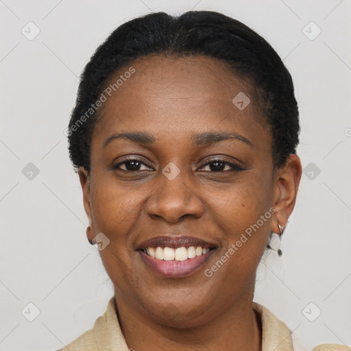Joyful black adult female with short  black hair and brown eyes