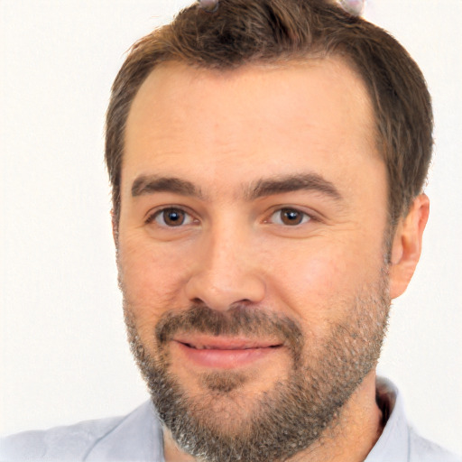 Joyful white adult male with short  brown hair and brown eyes