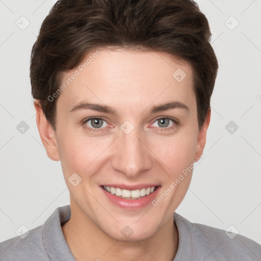 Joyful white young-adult female with short  brown hair and grey eyes