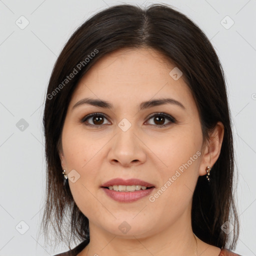 Joyful white young-adult female with medium  brown hair and brown eyes