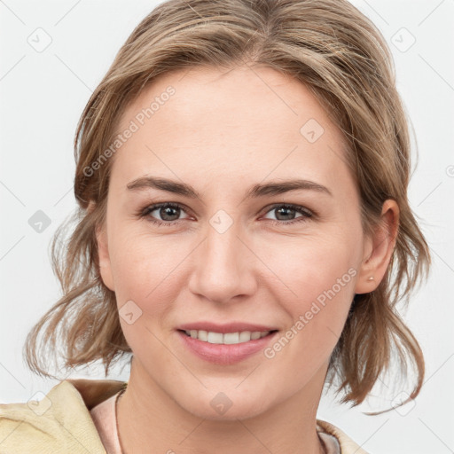 Joyful white young-adult female with medium  brown hair and blue eyes