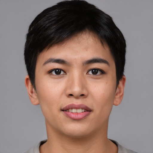 Joyful asian young-adult male with short  brown hair and brown eyes