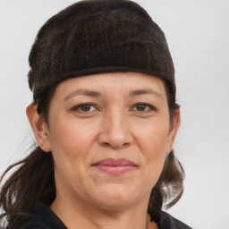 Joyful white adult female with medium  brown hair and grey eyes