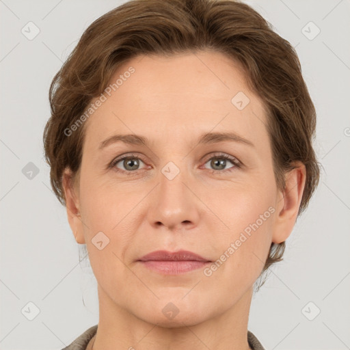 Joyful white adult female with short  brown hair and grey eyes