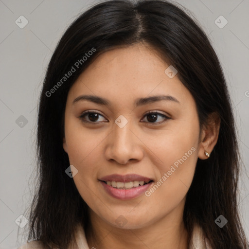 Joyful latino young-adult female with long  brown hair and brown eyes