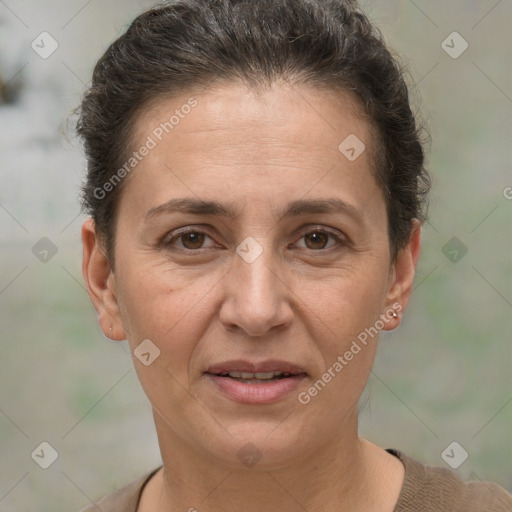 Joyful white adult female with short  brown hair and brown eyes