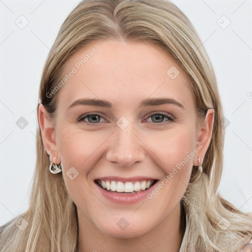 Joyful white young-adult female with long  brown hair and blue eyes