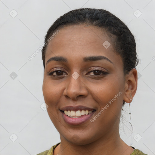 Joyful latino young-adult female with short  brown hair and brown eyes