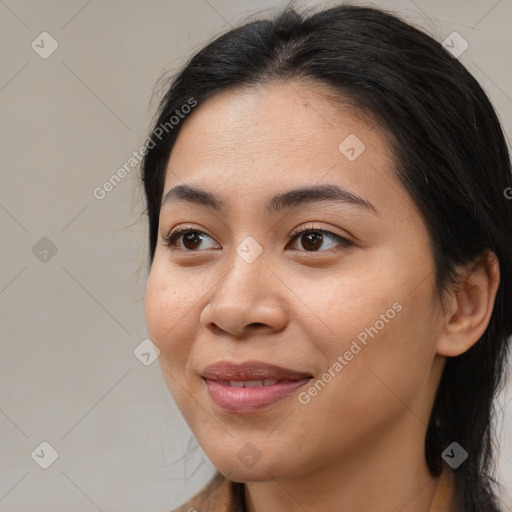 Joyful asian young-adult female with medium  brown hair and brown eyes