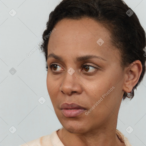 Neutral black young-adult female with short  black hair and brown eyes