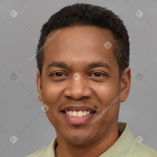 Joyful latino young-adult male with short  brown hair and brown eyes