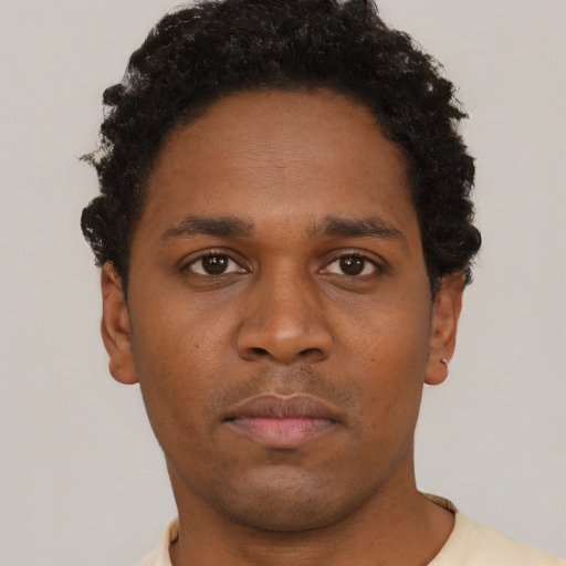 Neutral black young-adult male with short  brown hair and brown eyes