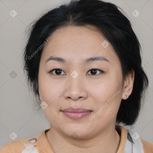 Joyful asian young-adult female with medium  brown hair and brown eyes