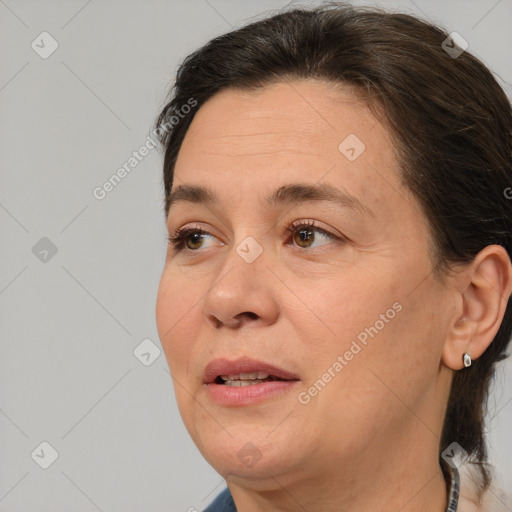 Joyful white adult female with medium  brown hair and brown eyes