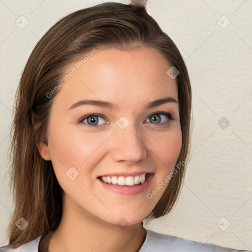 Joyful white young-adult female with long  brown hair and blue eyes